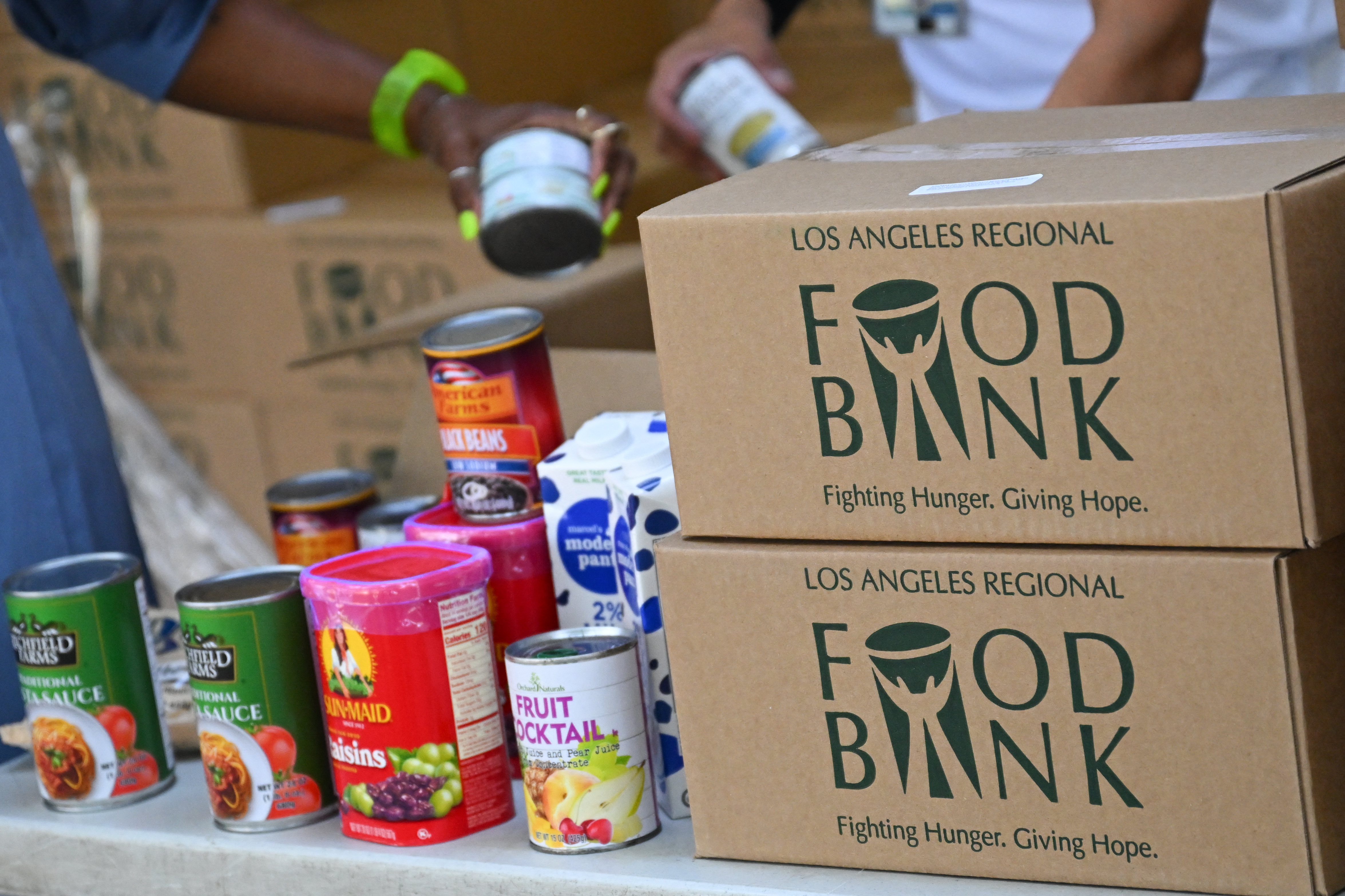 The Los Angeles Regional Food Bank provided boxes of groceries for a food giveaway in August. Food insecurity is expected to increase as government assistance programs are scaled back.
